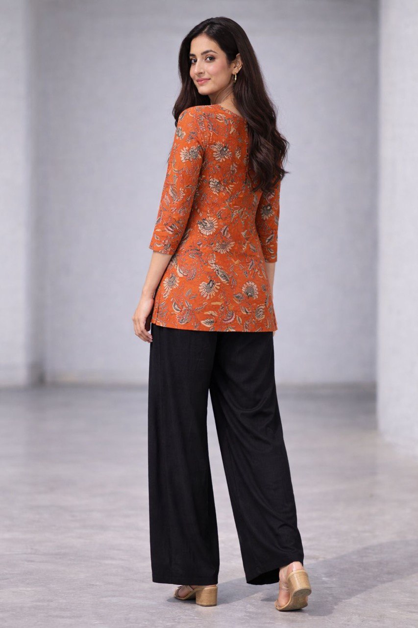 orange floral printed kurti with black palazzo