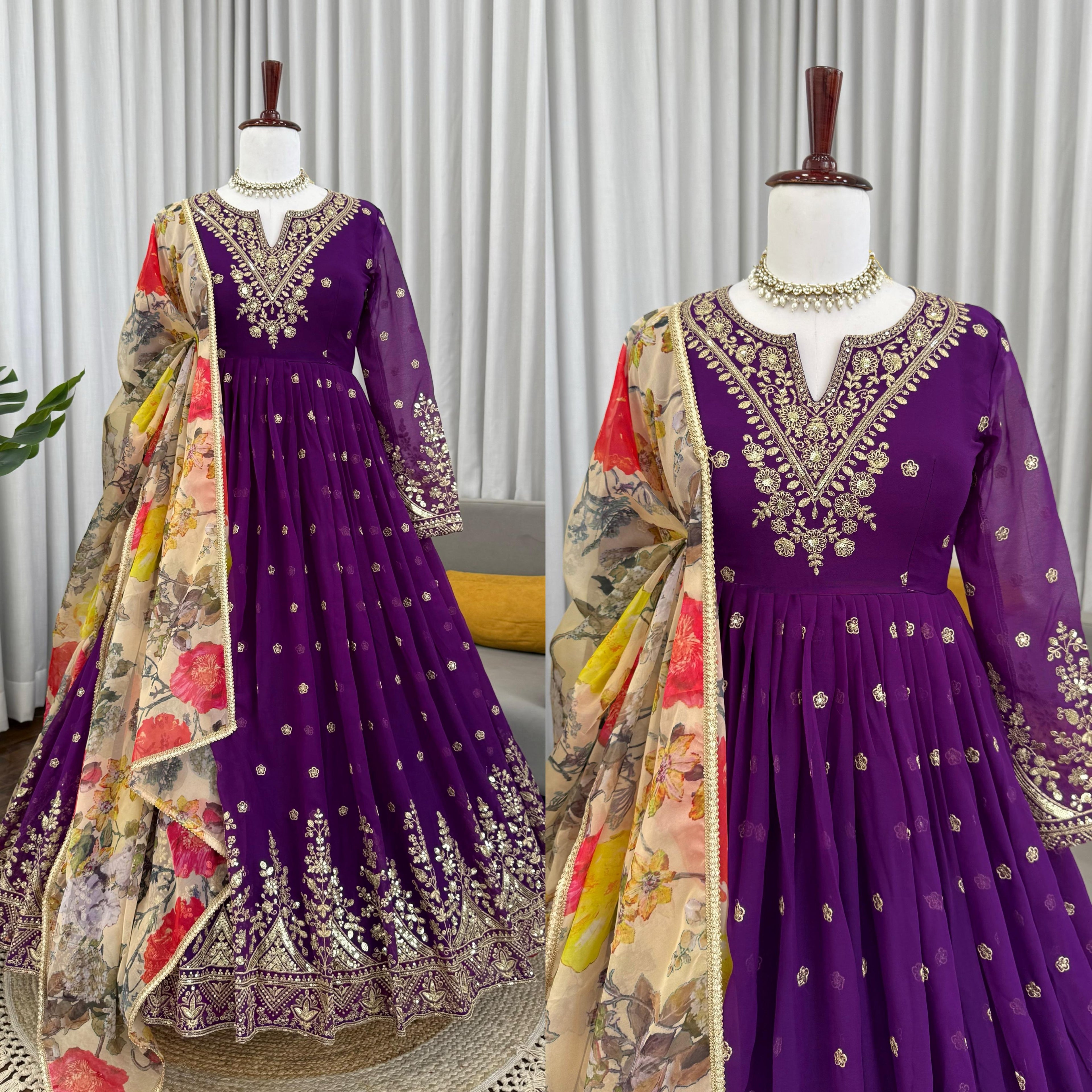 Purple embroidered dress with floral dupatta on mannequins against a neutral background