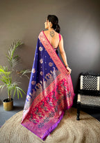 Woman wearing a colorful saree with a dark background