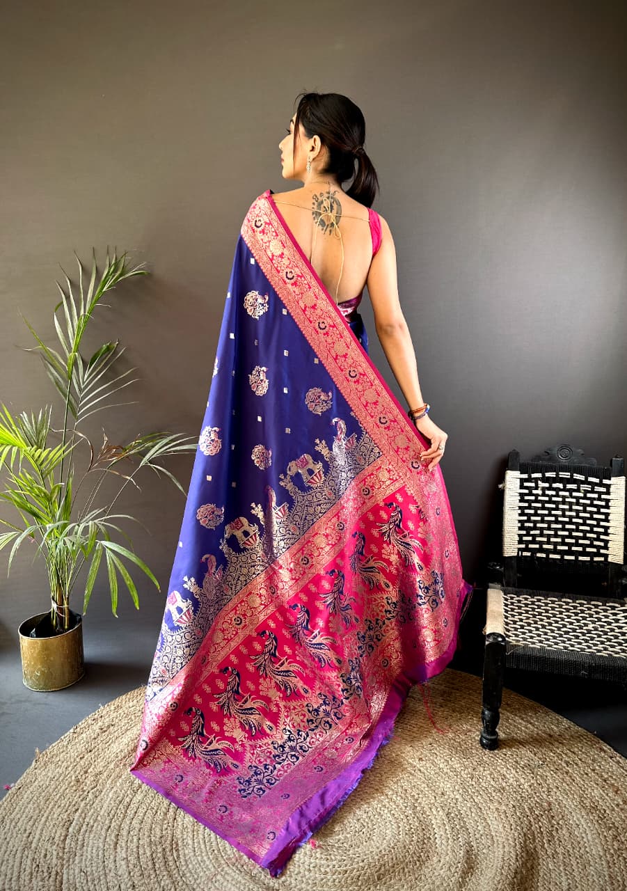 Woman wearing a colorful saree with a dark background