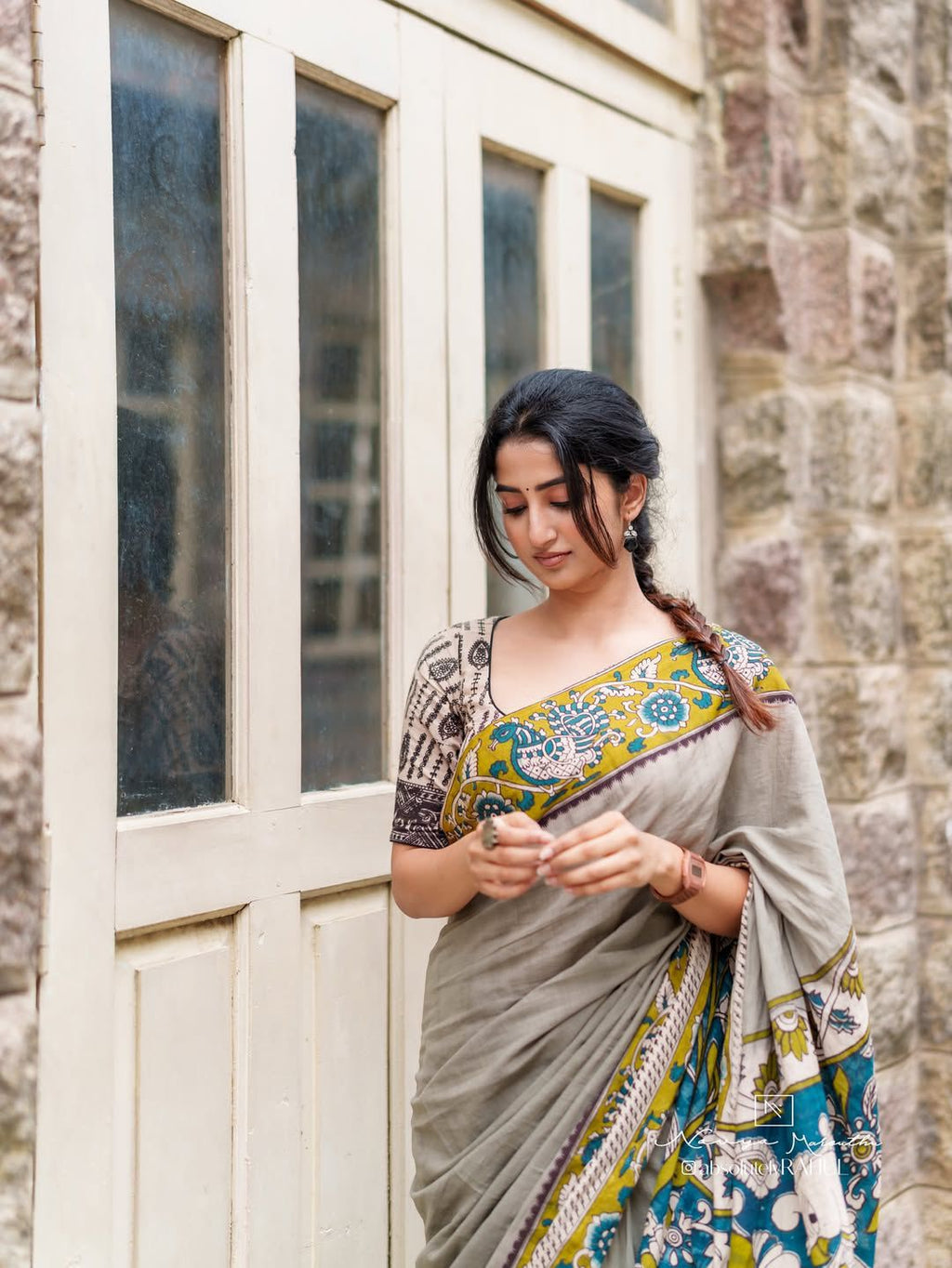 Traditional Kalamkari saree with modern styling
