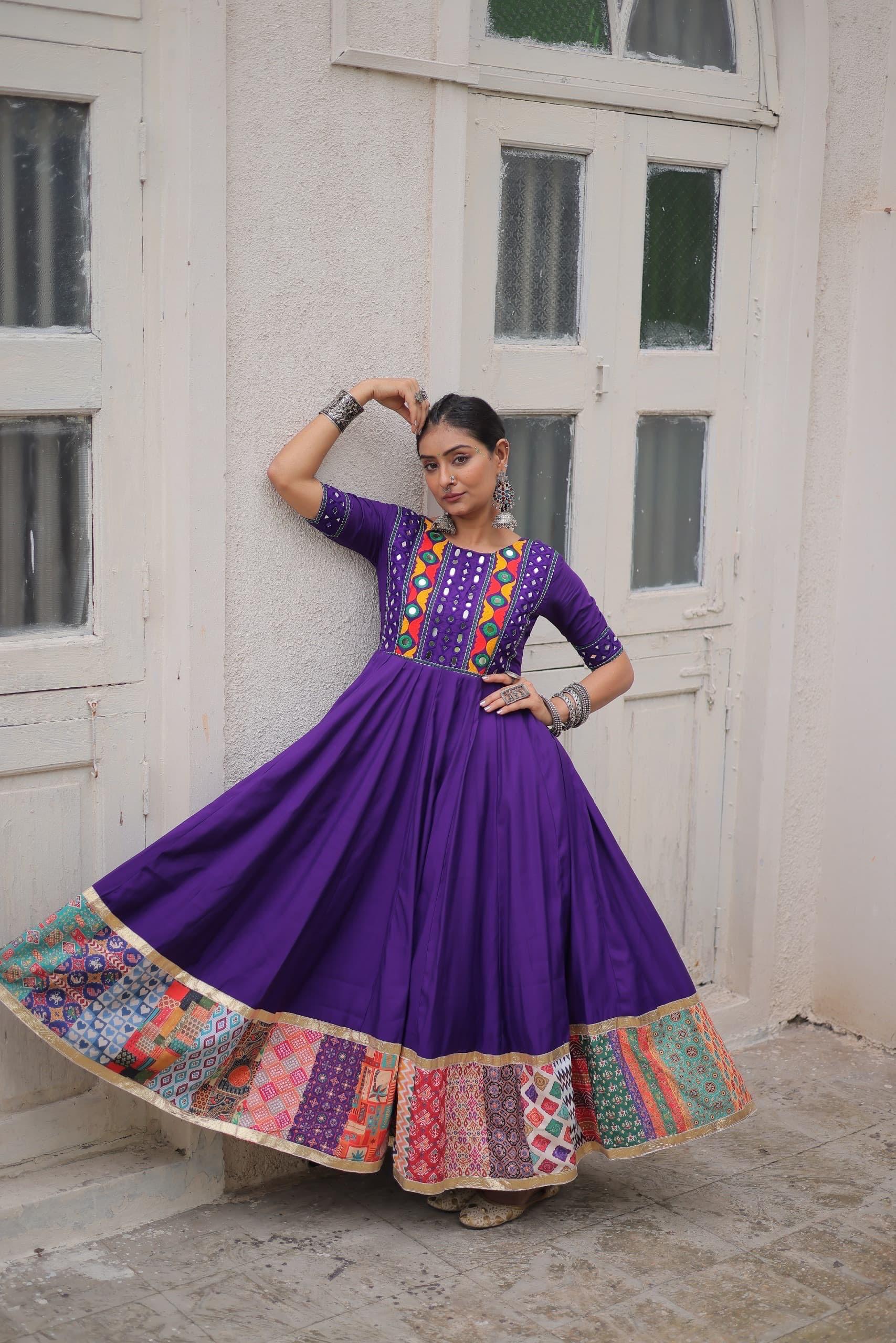 Purple Navratri Anarkali gown with mirror work and traditional embroidery
