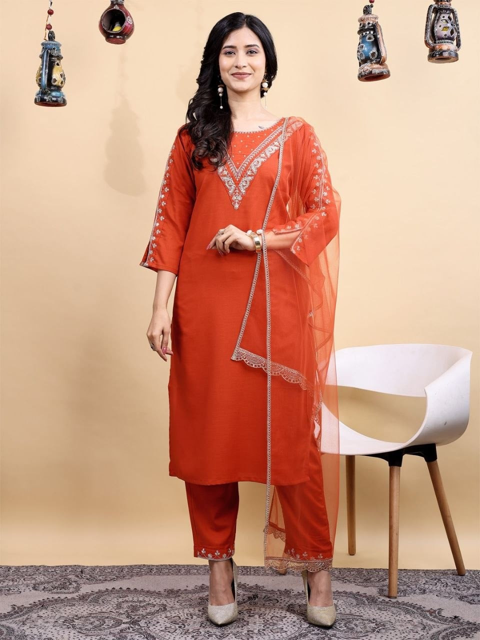 Orange kurta pant set with soft net dupatta and embroidery design  
