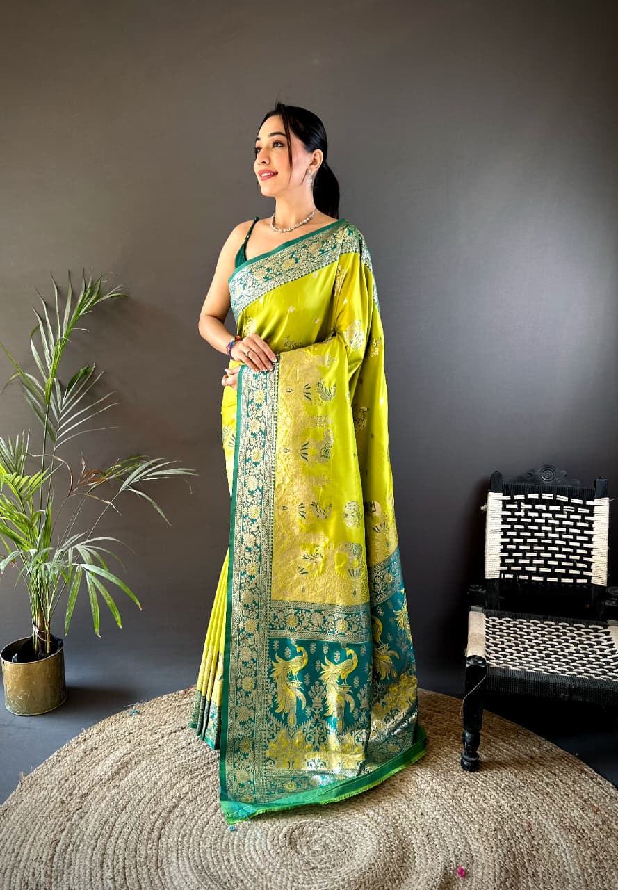 Yellow and green Paithani silk saree with zari border and traditional peacock design  
